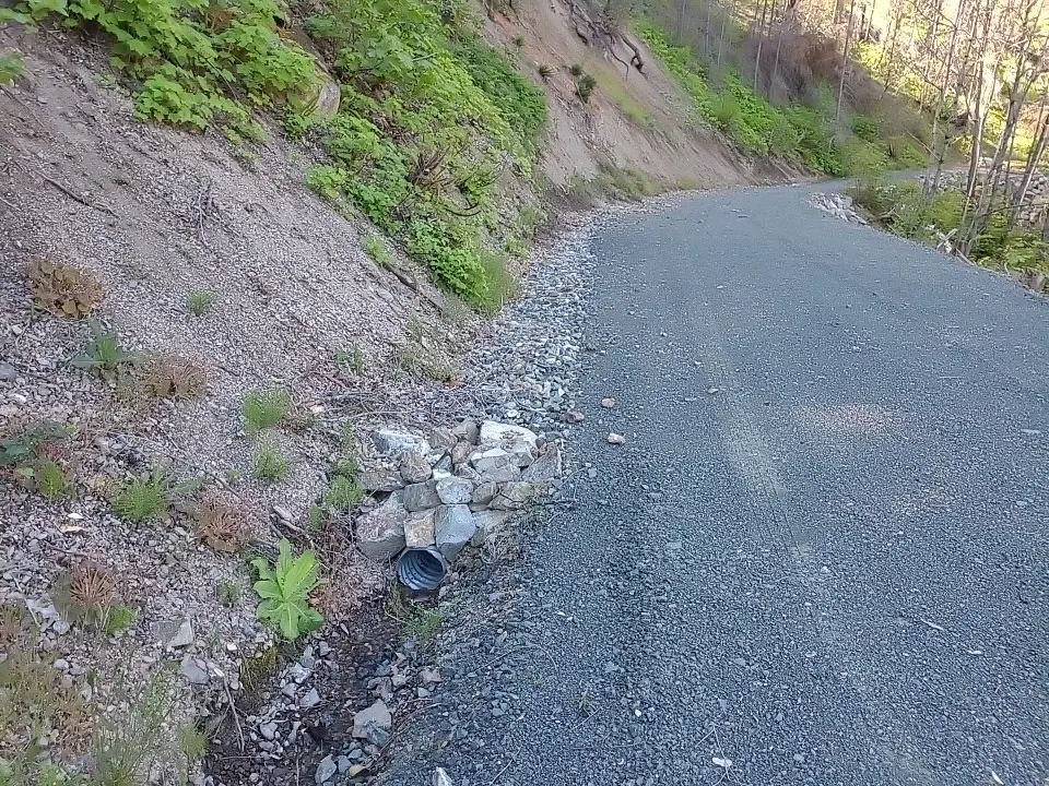 Roadside drainage culvert protected with stone